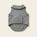 Heather grey sleeveless compression wrap for dogs, laid flat, showing the wide velcro closure panel across the torso